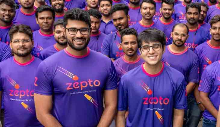 CEO and co-founders Aadit Palicha and Kaivalya Vohra posing  with Zepto employees. 