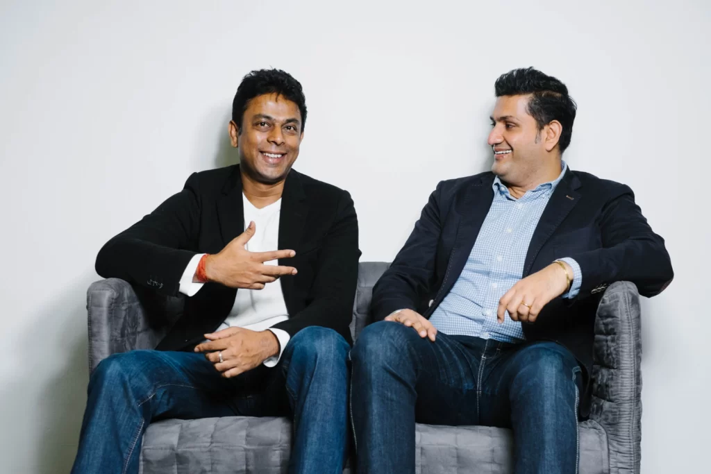  Jungle Ventures founding partners: Anurag Srivastava and Amit Anand sitting on a sofa.