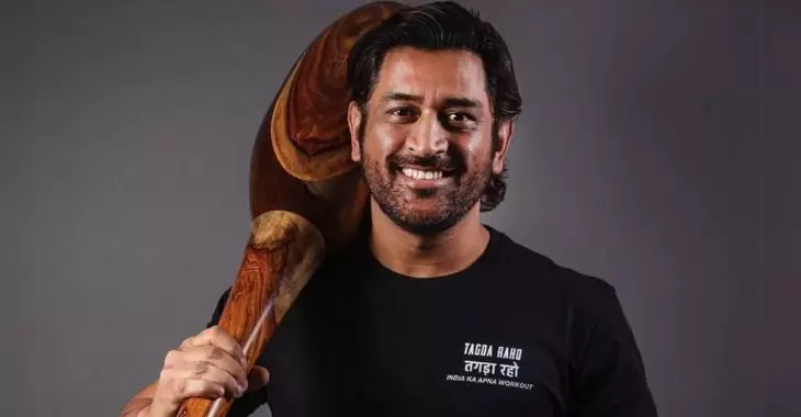 MS Dhoni posing with a Gada on his shoulder. 
